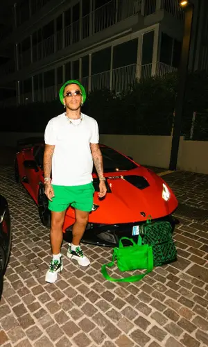 Sfera Ebbasta’s Outfit in Dior Sneakers, Chrome Hearts Eyewear & Bottega Veneta Hat (2023)