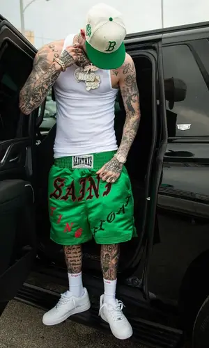 Millyz wearing Boston Red Sox cap