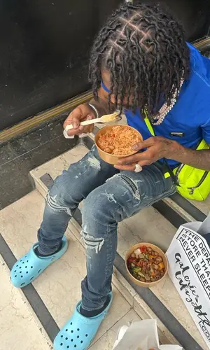 Russ Millions wearing Dolce & Gabbana t-shirt