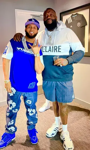 Rick Ross wearing Luc Belaire hoody