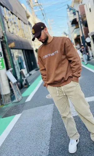 KR$NA wearing New Era cap