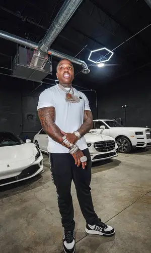 BandMan Kevo wearing Moncler pants