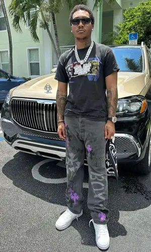 Lil Meech wearing Chrome Hearts scarf