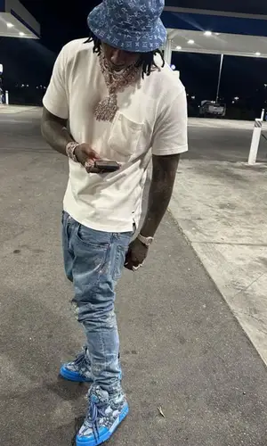 Moneybagg Yo wearing Louis Vuitton t-shirt