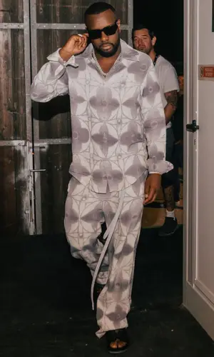 Gims wearing Louis Vuitton pants