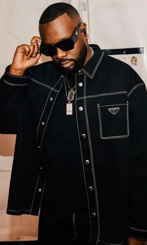 Gims wearing Prada eyewear