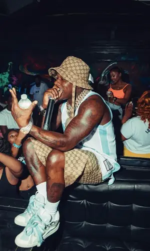DaBaby wearing Gucci shorts