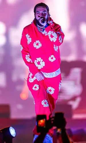 French Montana wearing Denim Tears pants