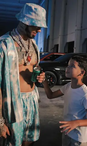 Anuel AA wearing Amiri hat