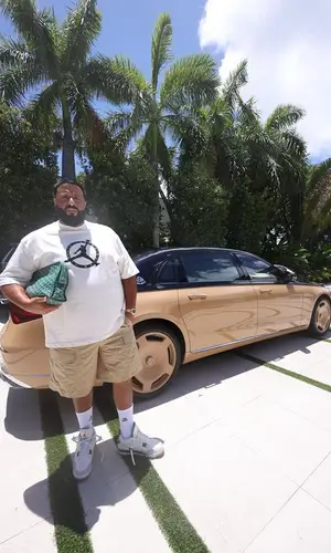 DJ Khaled wearing Goyard bag