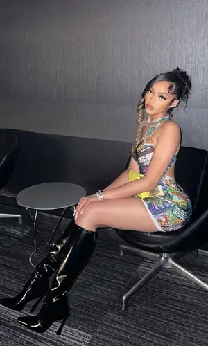 Jodie Woods wearing Saint Laurent boots