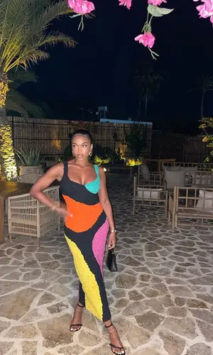 Lori Harvey’s Outfit in Hermes Bag, Loewe Sandals & Mara Hoffman (2023)
