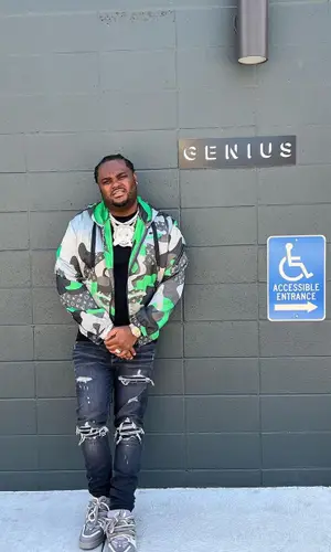 Tee Grizzley wearing Louis Vuitton jacket