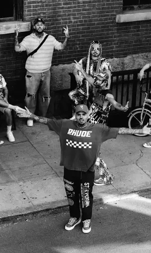 Chris Brown wearing Rhude t-shirt