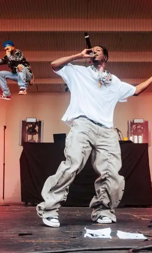 Joey Badass’ Outfit in Vidin Was Taken T-Shirt, Maison Mihara Yasuhiro Sneakers & Prada Eyewear (2023)