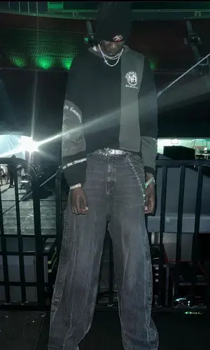 Bol Bol wearing Chrome Hearts belt