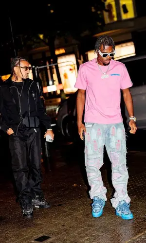 Carney Chukwuemeka wearing Louis Vuitton sneakers