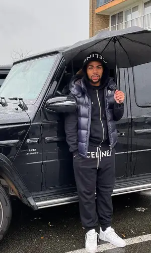Gambi wearing Nike sneakers