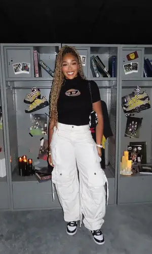 Jordyn Woods’ Outfit in Diesel Top, The Attico Jeans & Chanel Bag (2023)