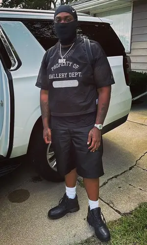 Peezy wearing Nike other