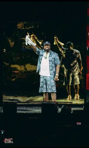 50 Cent’s Outfit in Denim Tears Shirt, New Era Cap & Dior (2023)
