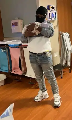 42 Dugg wearing Amiri jeans