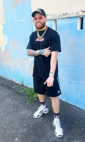 Miky Woodz wearing Palm Angels t-shirt