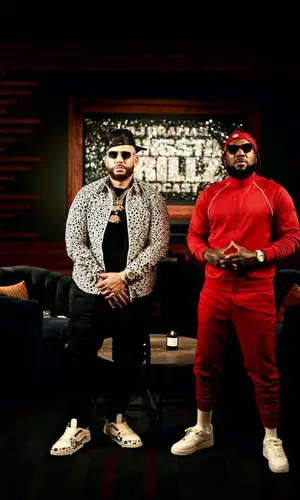 DJ Drama’s Outfit in Louis Vuitton Shirt, Dior Eyewear & Amiri Cap (2023)