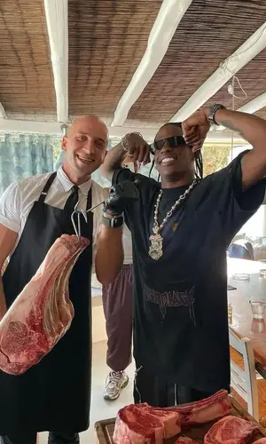 Travis Scott wearing Rick Owens shorts
