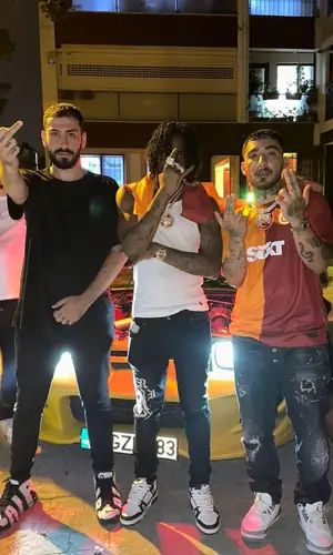 Russ Millions’ Outfit in Polo Ralph Lauren Top, Amiri Jeans & Louis Vuitton Sneakers (2023)