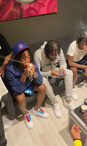 Russ Millions’ Outfit in Louis Vuitton Jacket, Nike Sneakers & New Era Cap (2023)