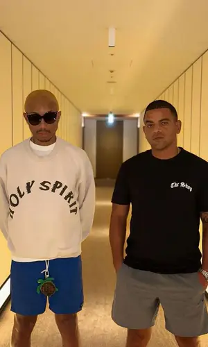 Pharrell Williams’ Outfit in Kanye West Merch Sweatshirt, Noah Shorts & Louis Vuitton Eyewear (2023)