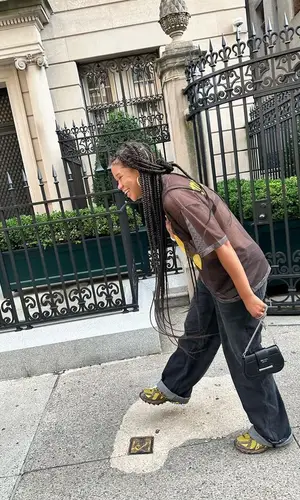 Storm Reid wearing Prada jeans