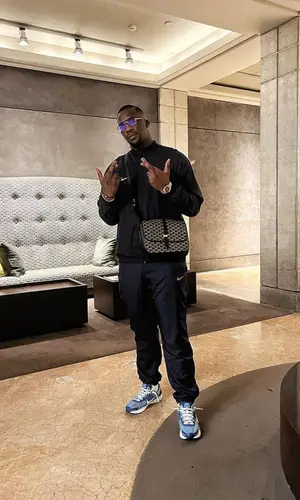 SDM wearing Nike sneakers