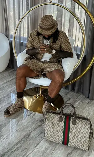 Money Man wearing Gucci shirt