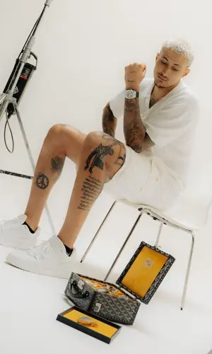 Kyle Kuzma wearing Louis Vuitton shorts