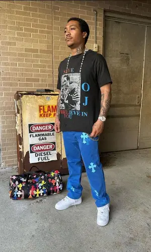 Lil Meech wearing Chrome Hearts bag