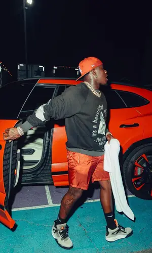 DaBaby wearing Samuel Zelig sweatshirt