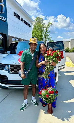 Jacquees wearing Louis Vuitton bag
