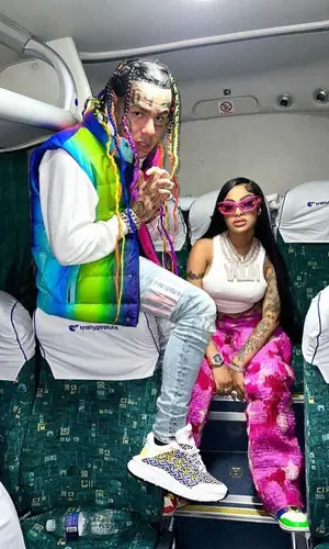 6ix9ine’s Outfit in AGR Knit Jacket, Amiri Jeans & Versace Sneakers (2023)