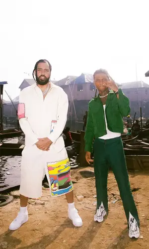 French Montana wearing The Elder Statesman shirt