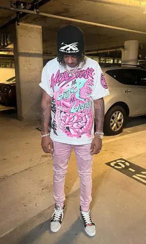 Skilla Baby’s Outfit in Amiri Jeans, Christian Louboutin Sneakers & Hellstar Hat (2023)