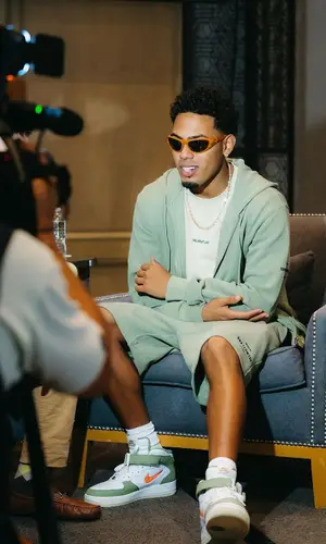Myke Towers wearing Helmut Lang hoody