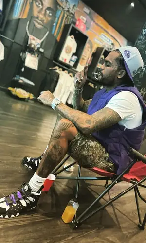 Dave East wearing Supreme jacket