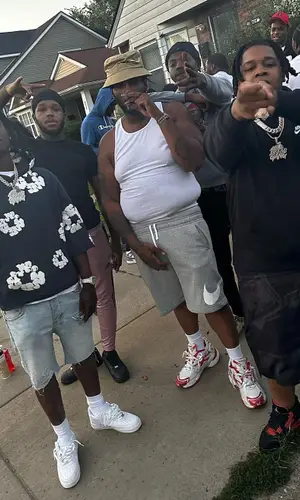 Peezy wearing Hanes top