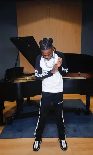 Cae Cartier wearing Chrome Hearts shirt