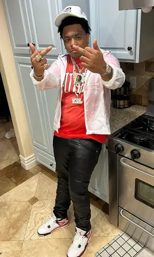 Lil Gotit’s Outfit in Purple Brand T-Shirt & Jordan Sneakers (2023)