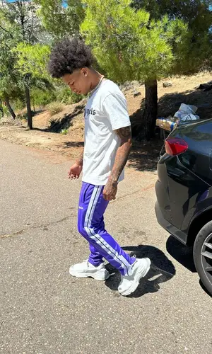 Mikey’s Outfit in Palm Angels T-Shirt & Balenciaga Sneakers (2023)
