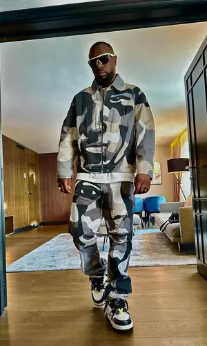Gims wearing Louis Vuitton pants