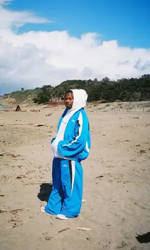 Asake wearing Balenciaga sneakers